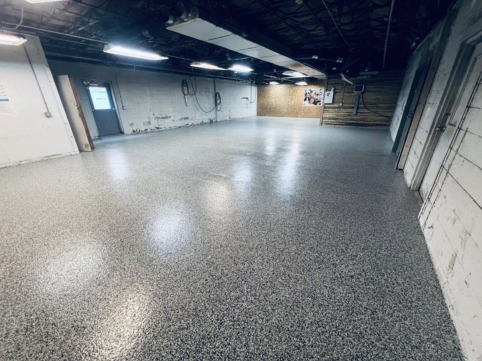 Tan epoxy-coated basement floor interior