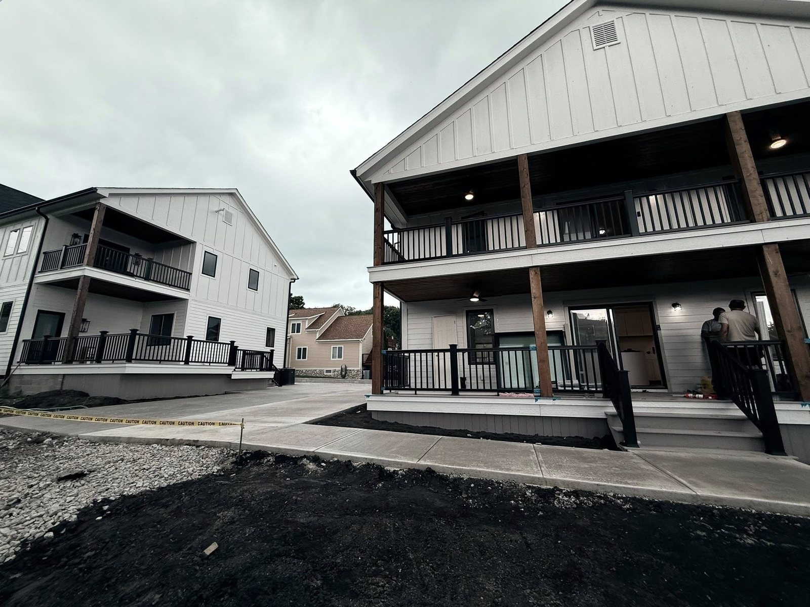 Concrete sidewalks running between apartment buildings