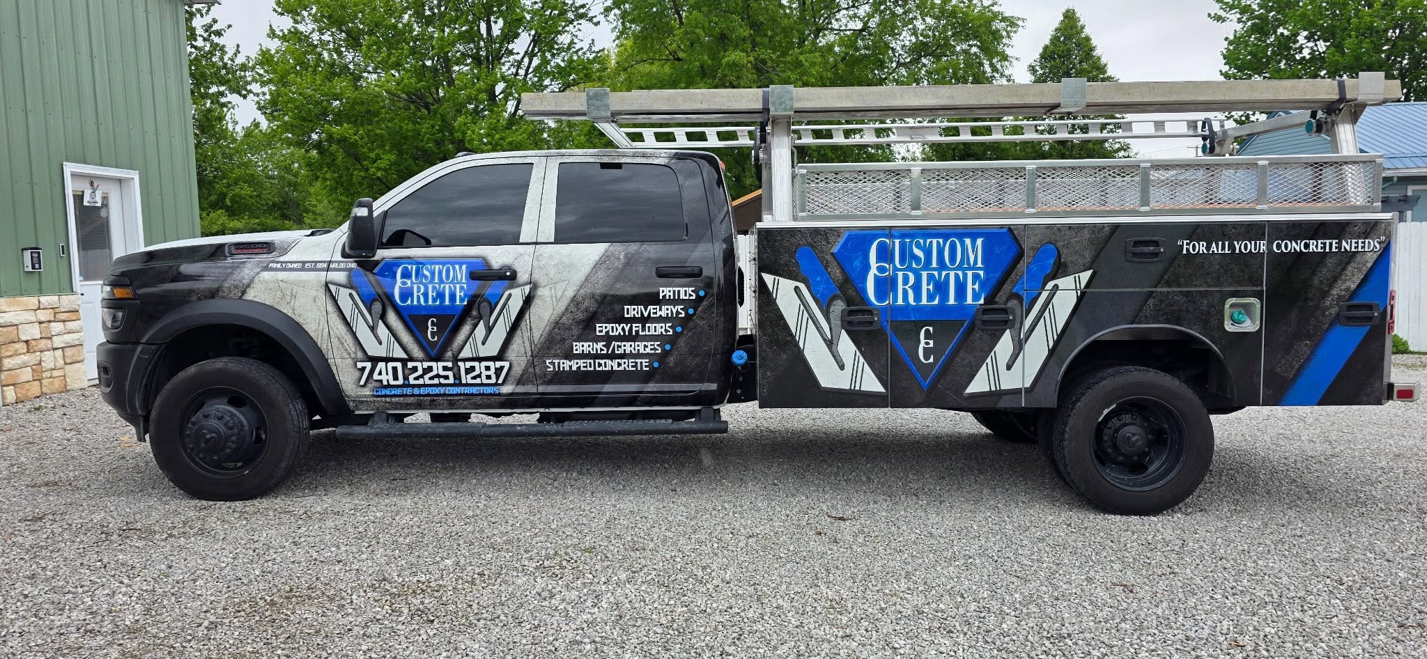 Custom Crete branded service truck wrapped in blue and silver, parked at the shop