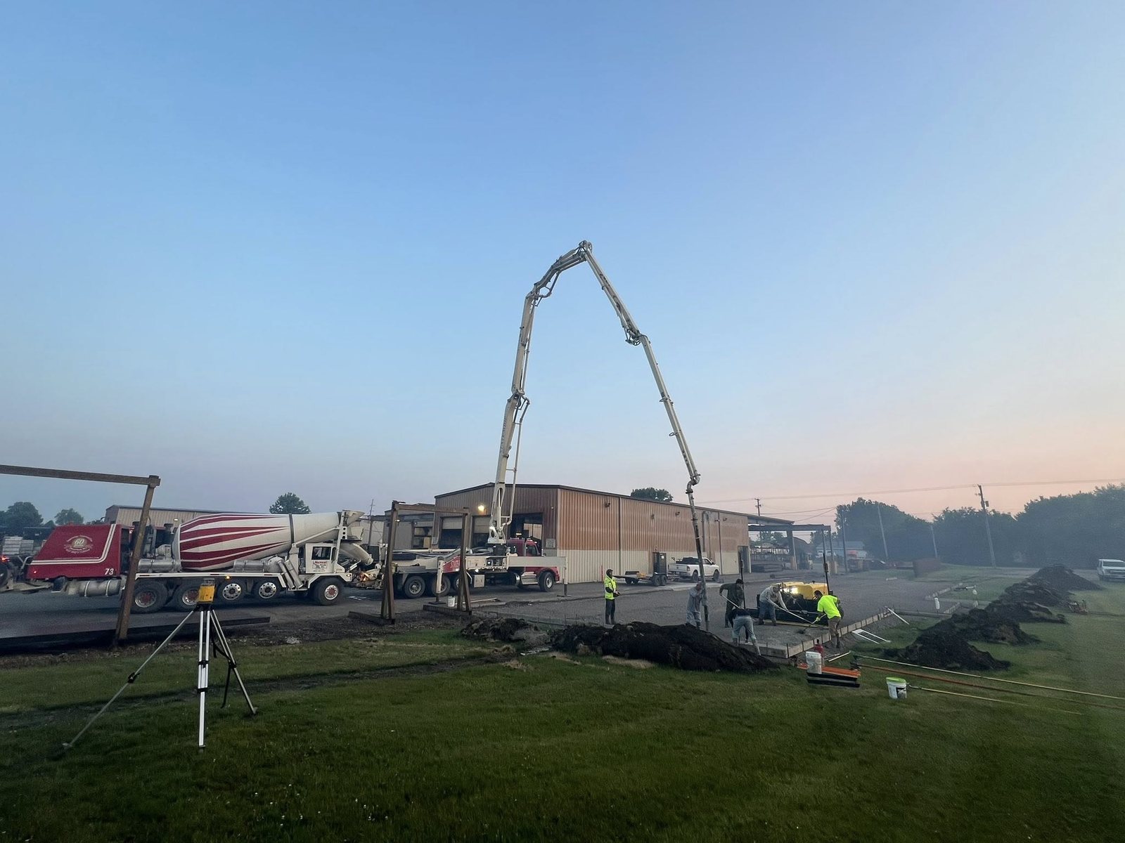 The Custom Crete crew finishing fresh concrete on a job site